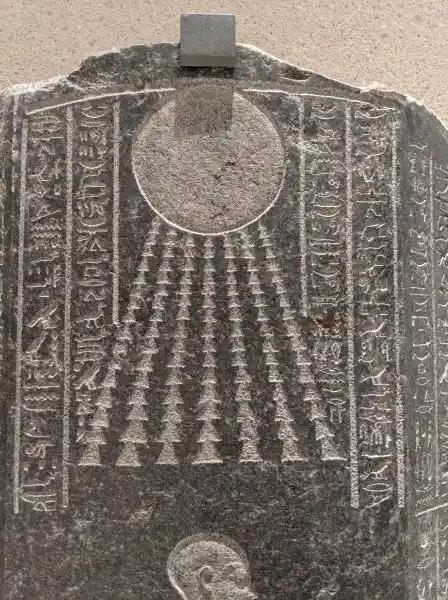 Close-up of the sun disc from the sarcophagus lid of Djehapimu, Royal Audit Officer. Late Period, 746-332 BC. Granite.